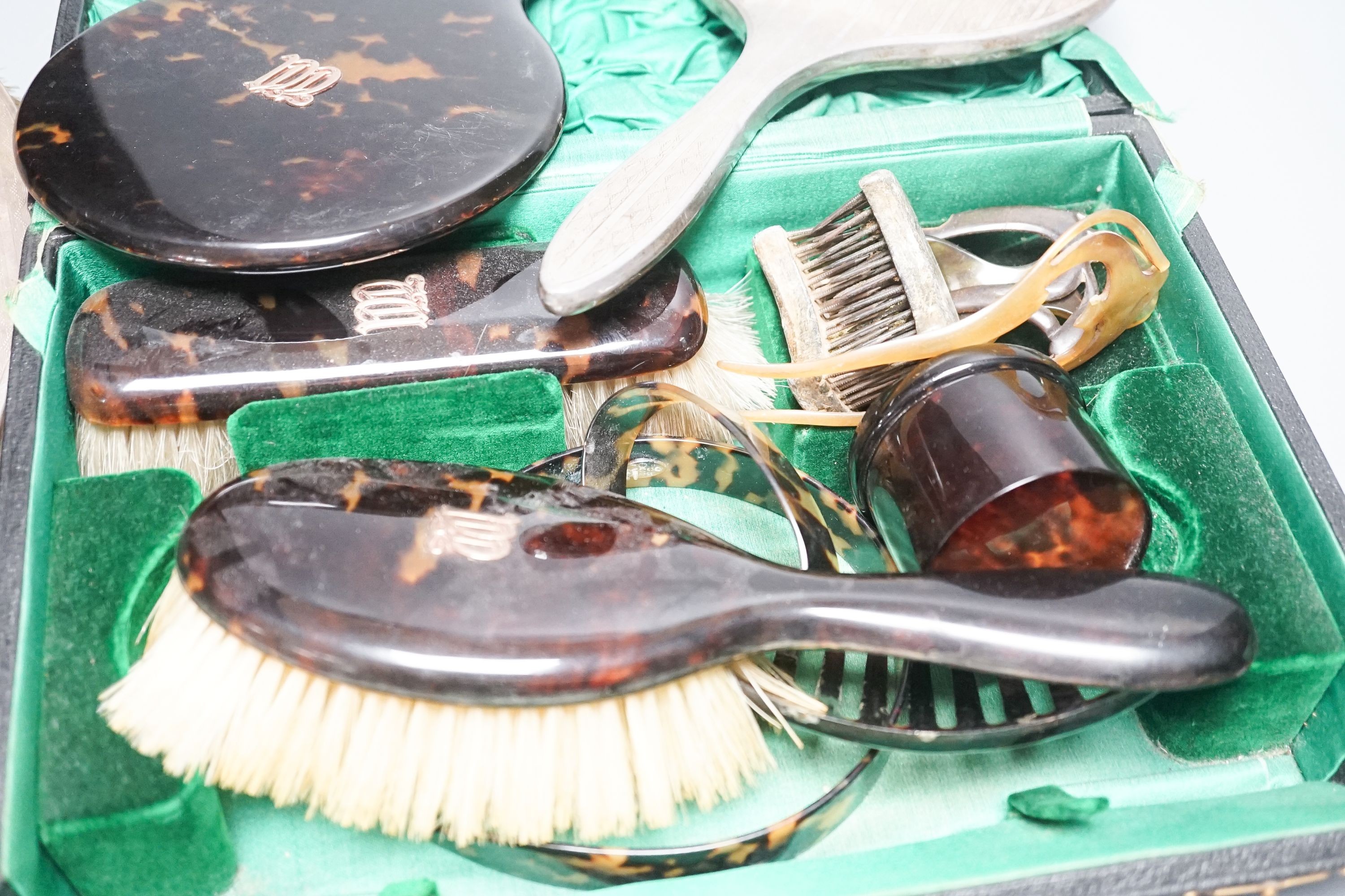 A tortoiseshell toilet set and silver dressing table items